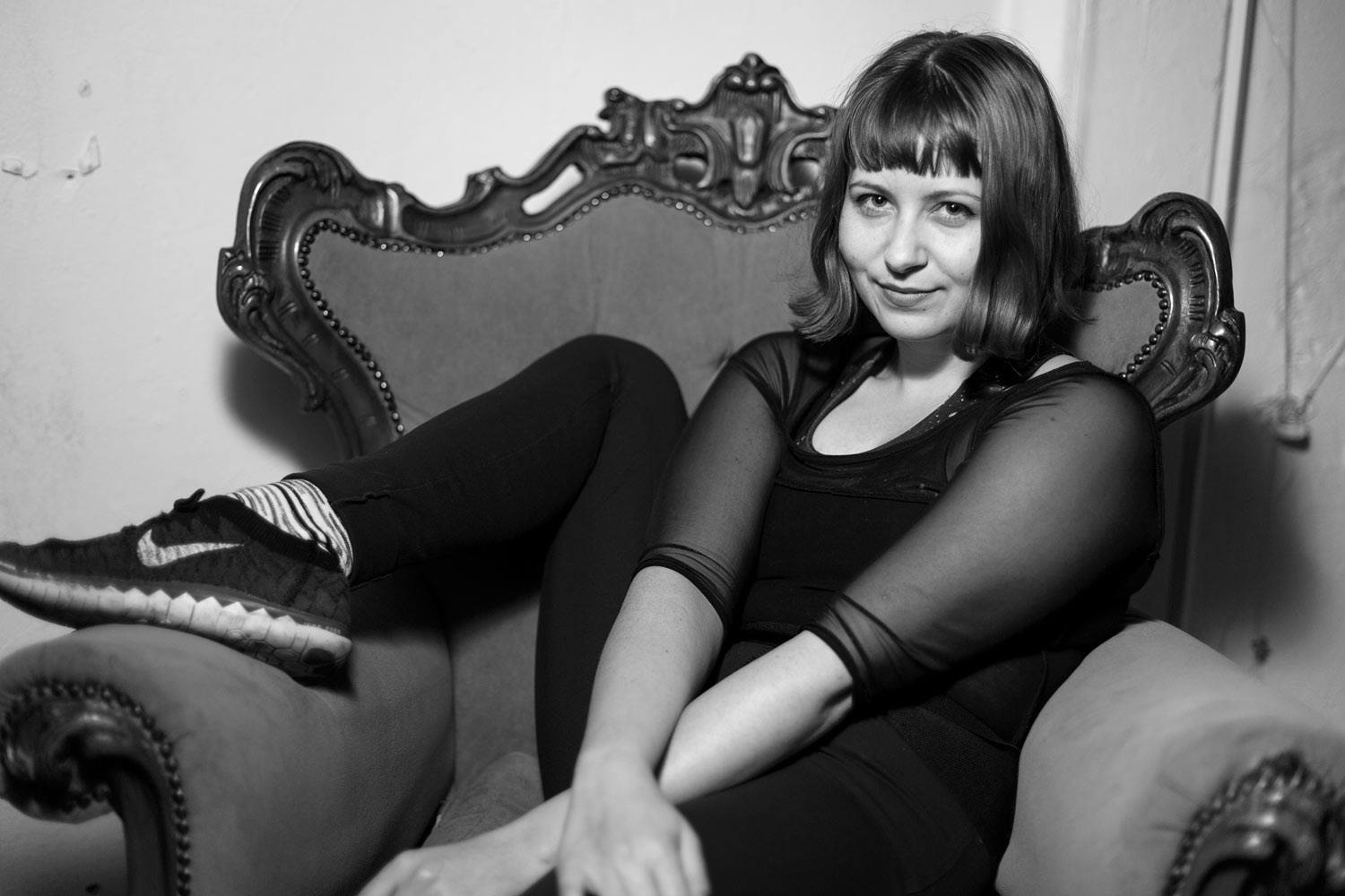 Woman sitting on a chair with leg up