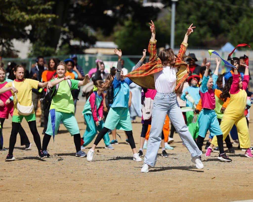 A group of young people in colourful outfits parade the streets in Athlone